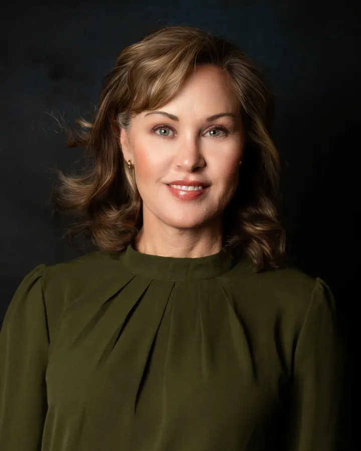 Woman in olive green blouse