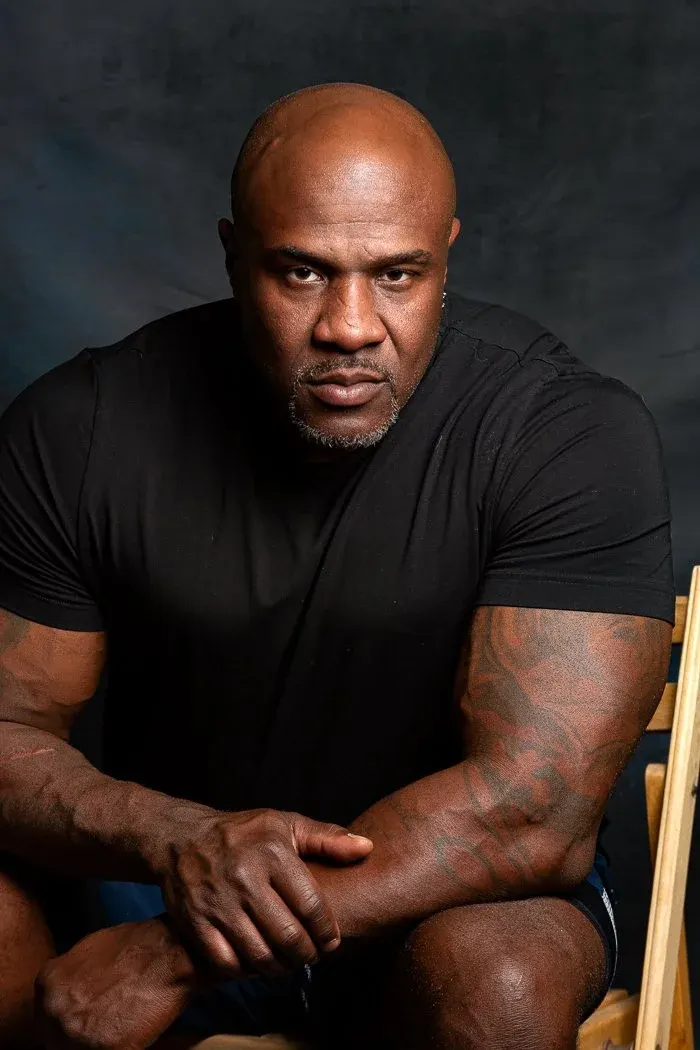Man with tattoos in black t-shirt