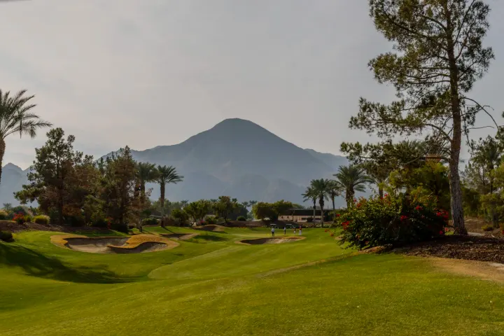 Golf course with hills and palm trees